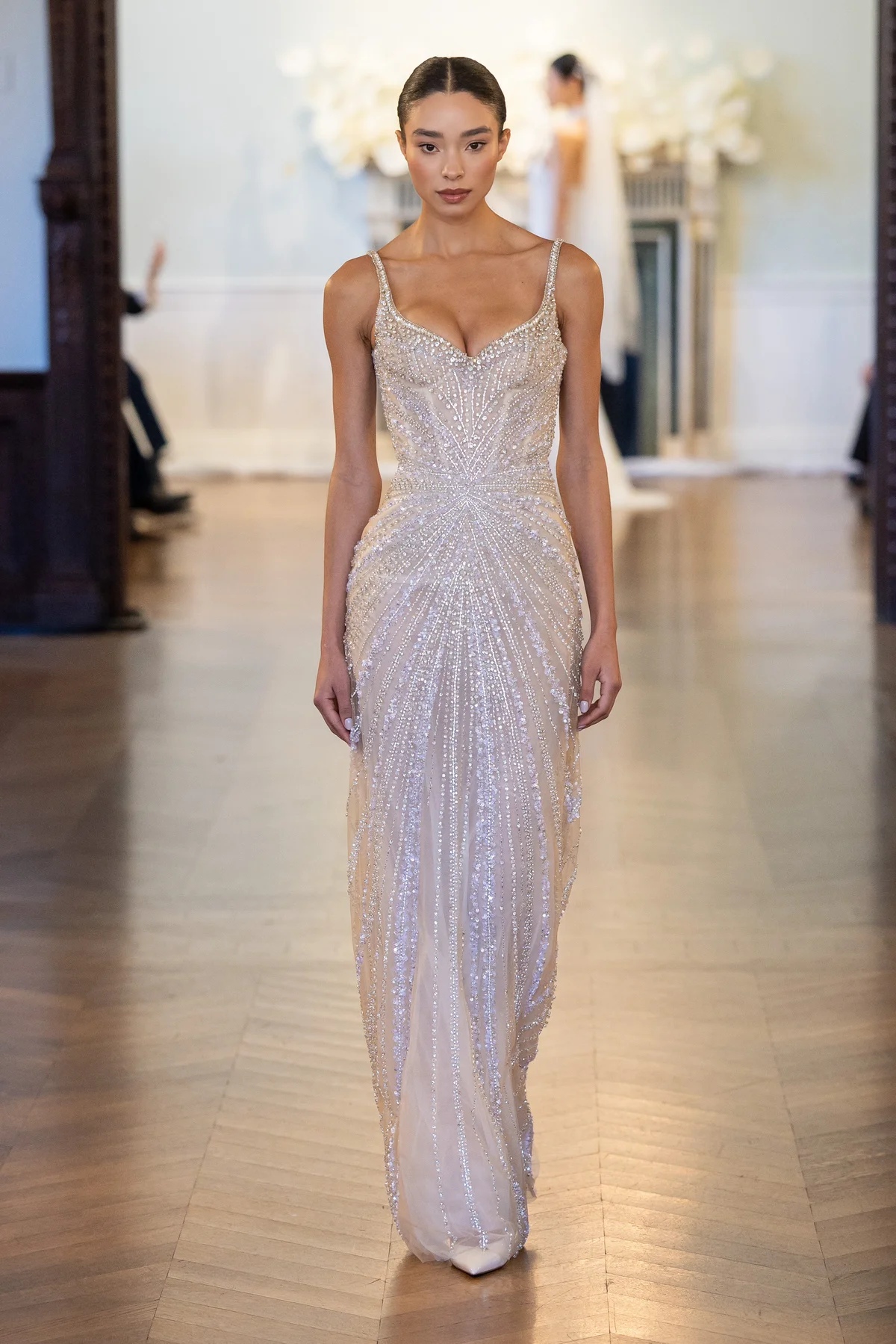 2708 - LEE PETRA GREBENAU - A fully hand-beaded, delicate overlay dress adorned with shimmering tassels and an embellished sweetheart neckline.