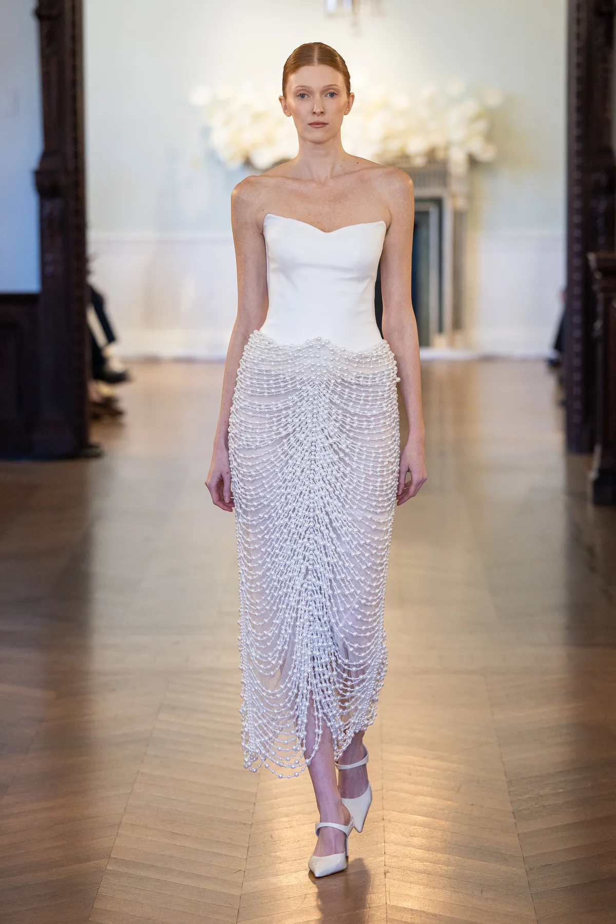 2709 - LEE PETRA GREBENAU - A fitted upper bodice crafted from Mikado silk and fully hand-sewn pearl skirt with cascading draped embellishments.