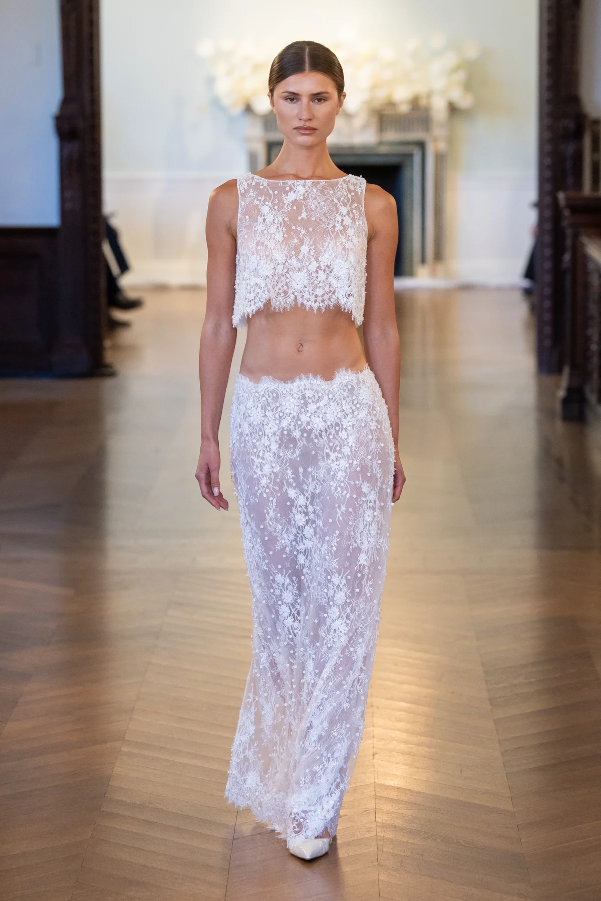 2711 - LEE PETRA GREBENAU - A two-piece, intricately beaded and embroidered midriff top and skirt set with lace embellishments.