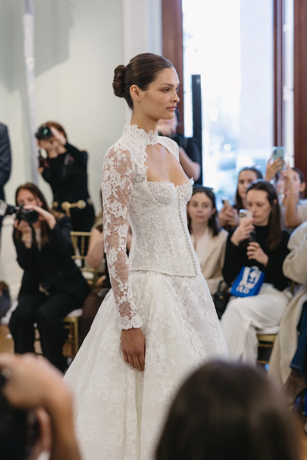 Lee Petra Grebenau bride in the Talisman gown — a long-sleeve embroidered lace ball gown — on the Salon Privé runway
