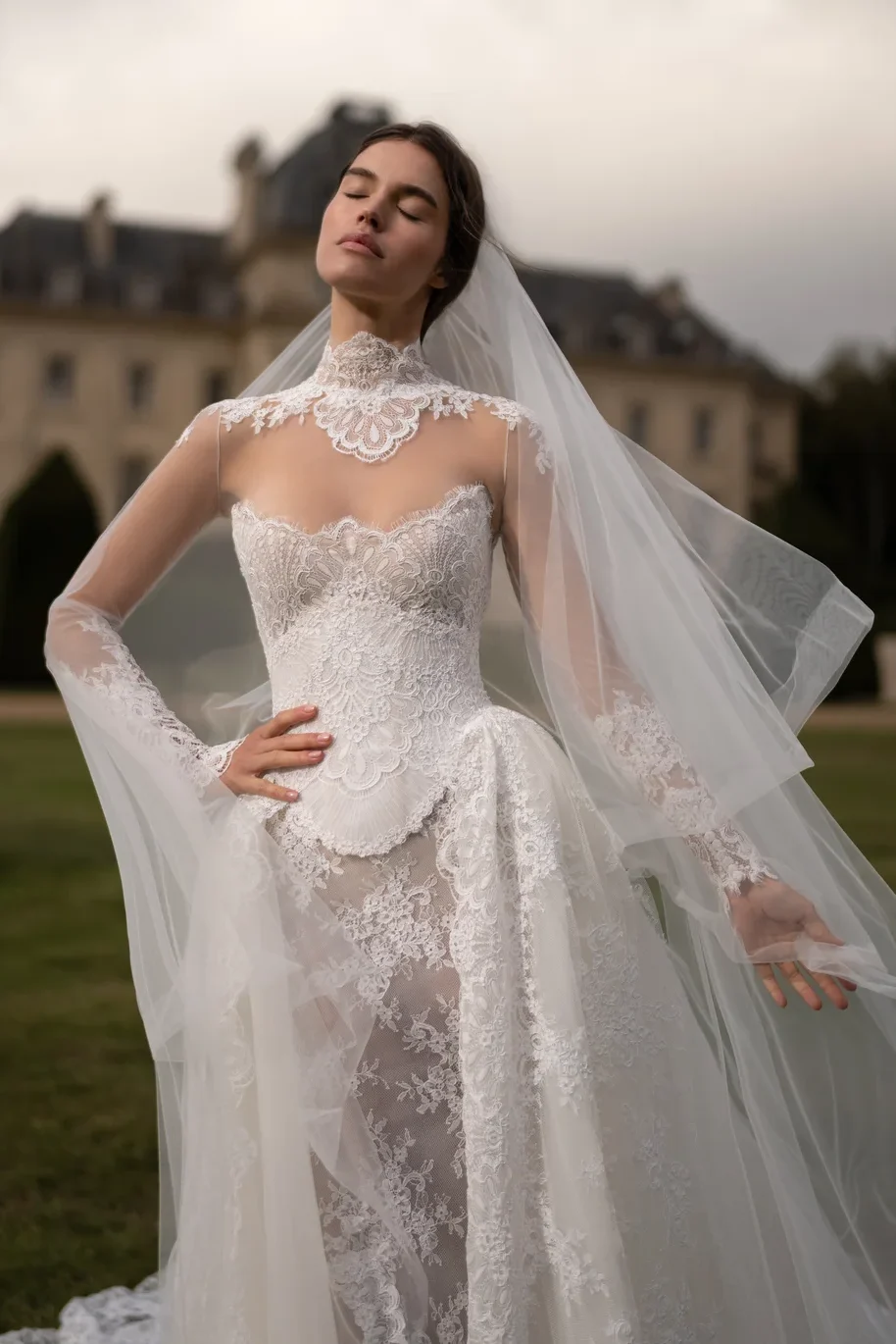 Lee Petra Grebenau Victoria gown with layered overskirt and veil — ceremonial bridal corsetry