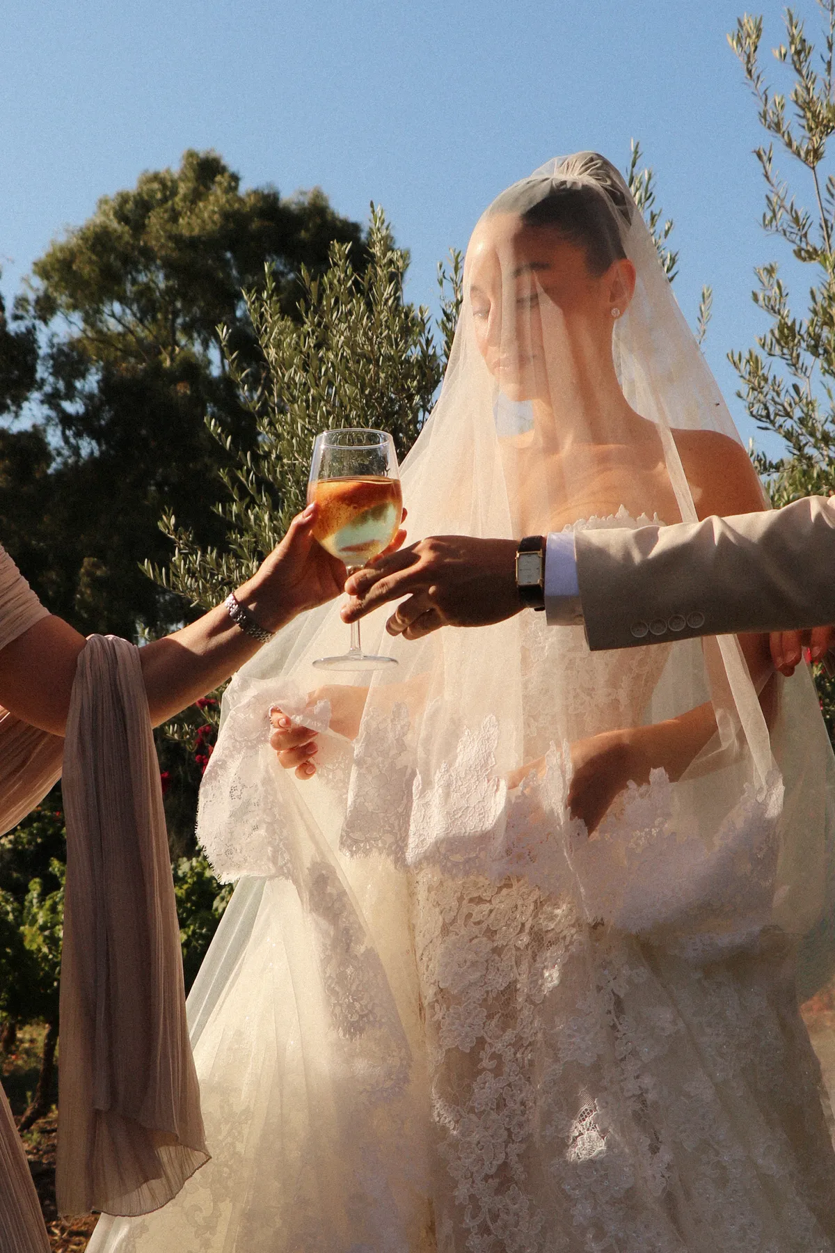 Lee Petra Grebenau bride Adi in the Talisman gown and veil during her wedding celebration