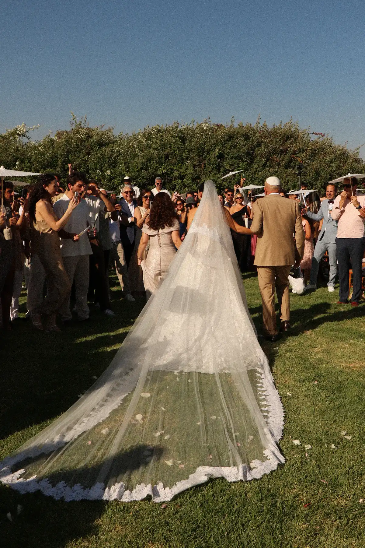 Bride walking down the aisle with a cathedral veil — Lee Petra Grebenau Talisman gown