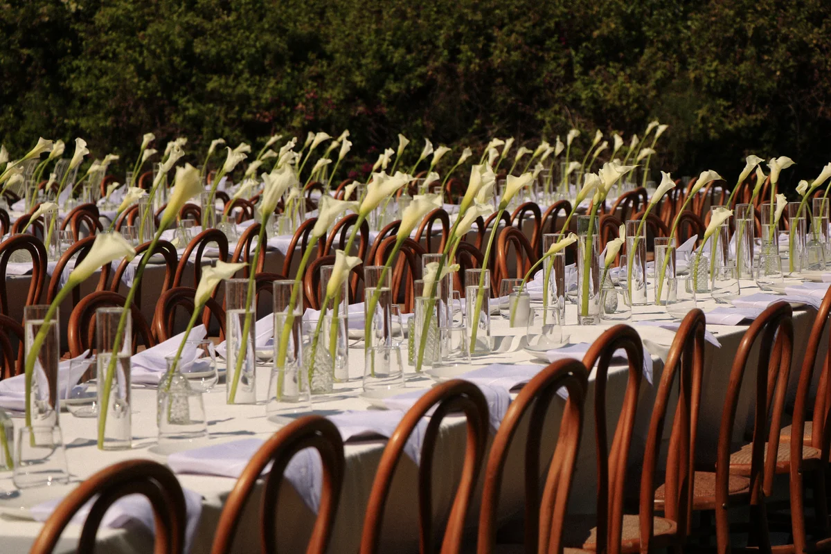 Reception table set with calla lilies — Lee Petra Grebenau bride Adi's wedding celebration