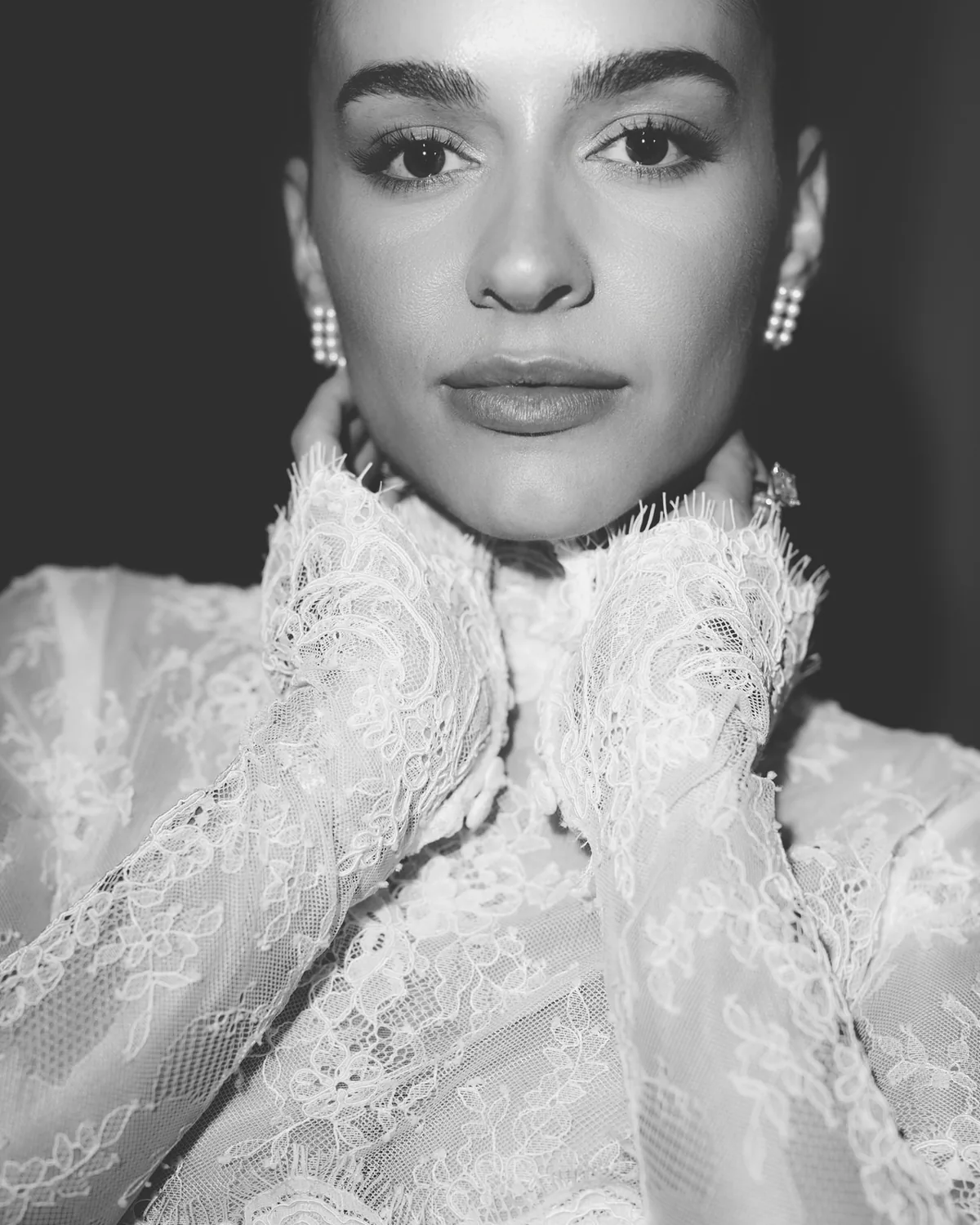 Portrait of Danielle in the high lace neckline of her Tosca gown by Lee Petra Grebenau
