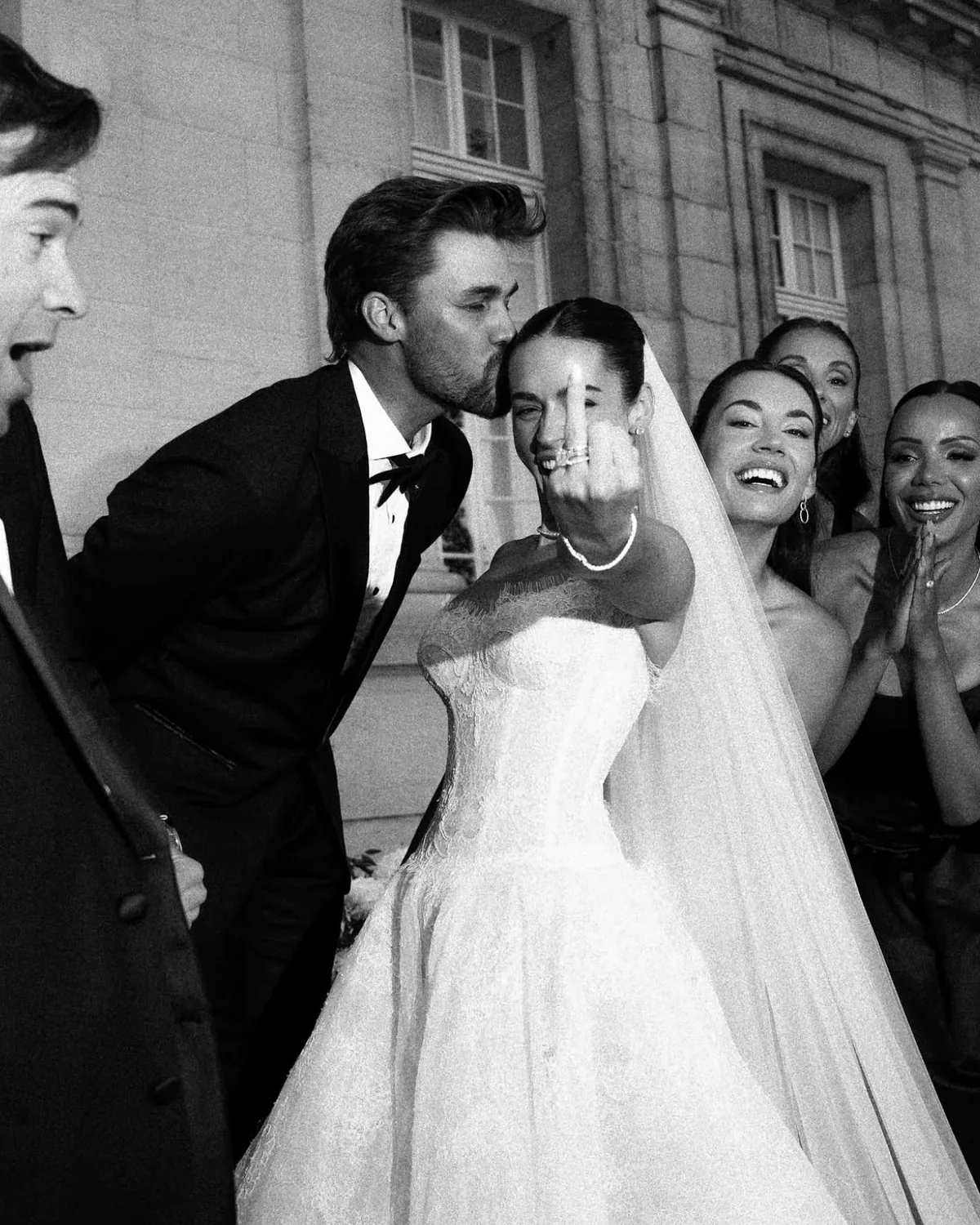 Spencer kissing Danielle as their guests cheer