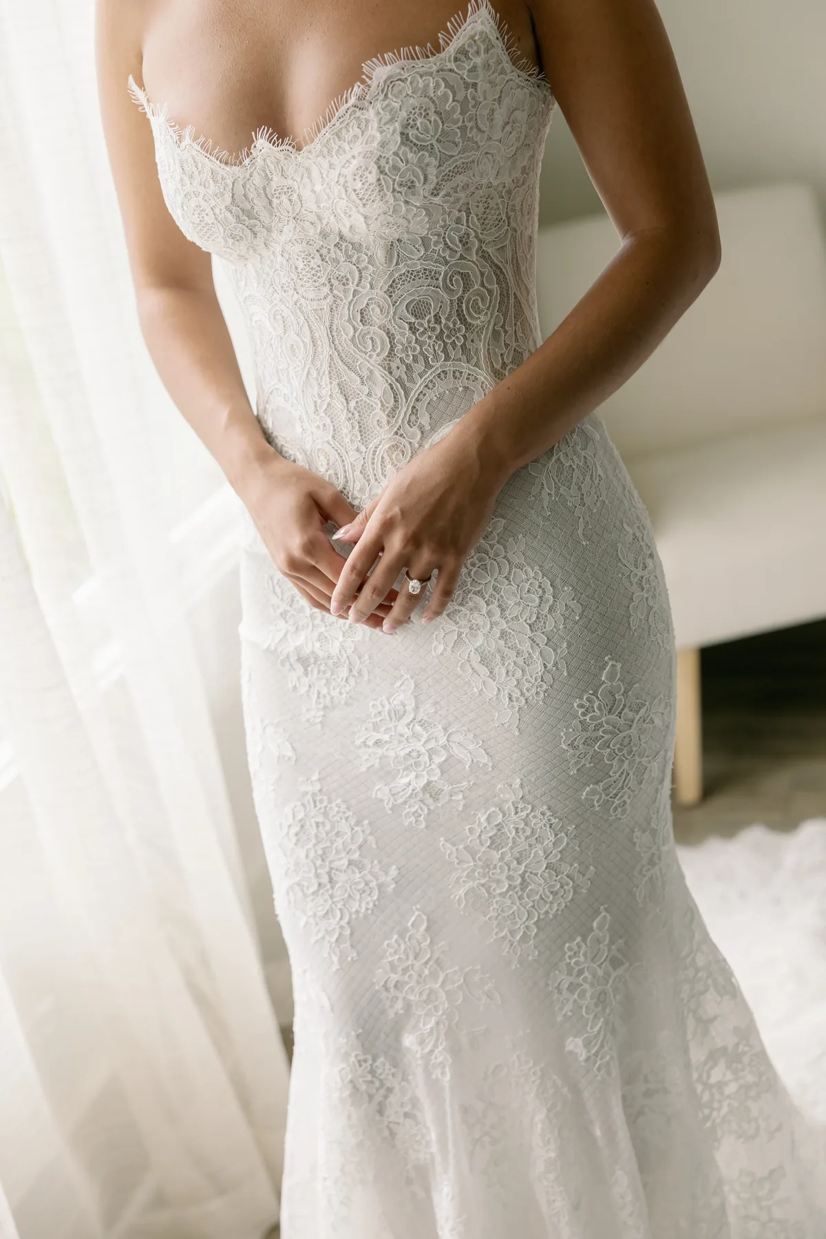 Close detail of the French lace and Chantilly finishes on Madison’s Tosca gown